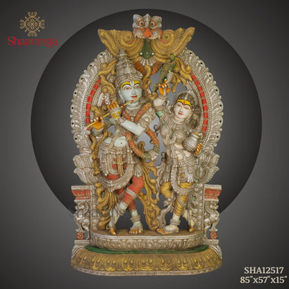 Radha–Krishna with Ornate Arch | Monumental Wooden Sculpture (85 × 57 Inches)
