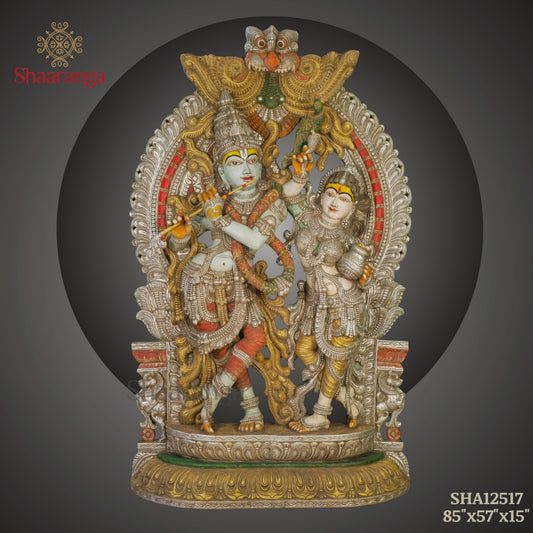 Radha–Krishna with Ornate Arch | Monumental Wooden Sculpture (85 × 57 Inches)