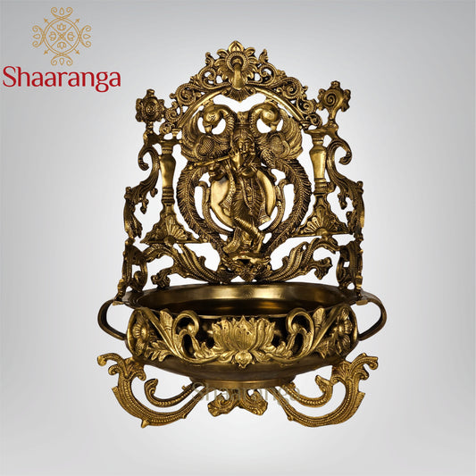 19 Inches Bronze Krishna Urli with intricate peacock and lotus design