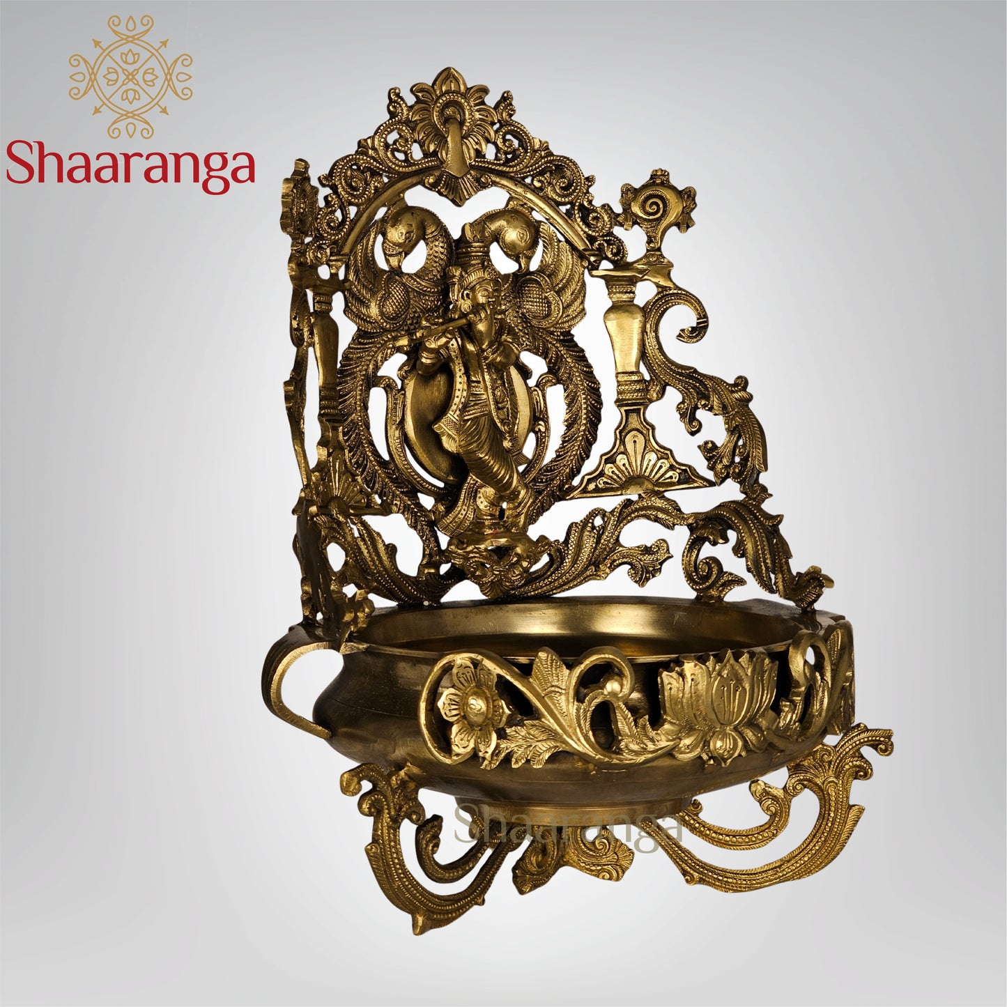 19 Inches Bronze Krishna Urli with intricate peacock and lotus design