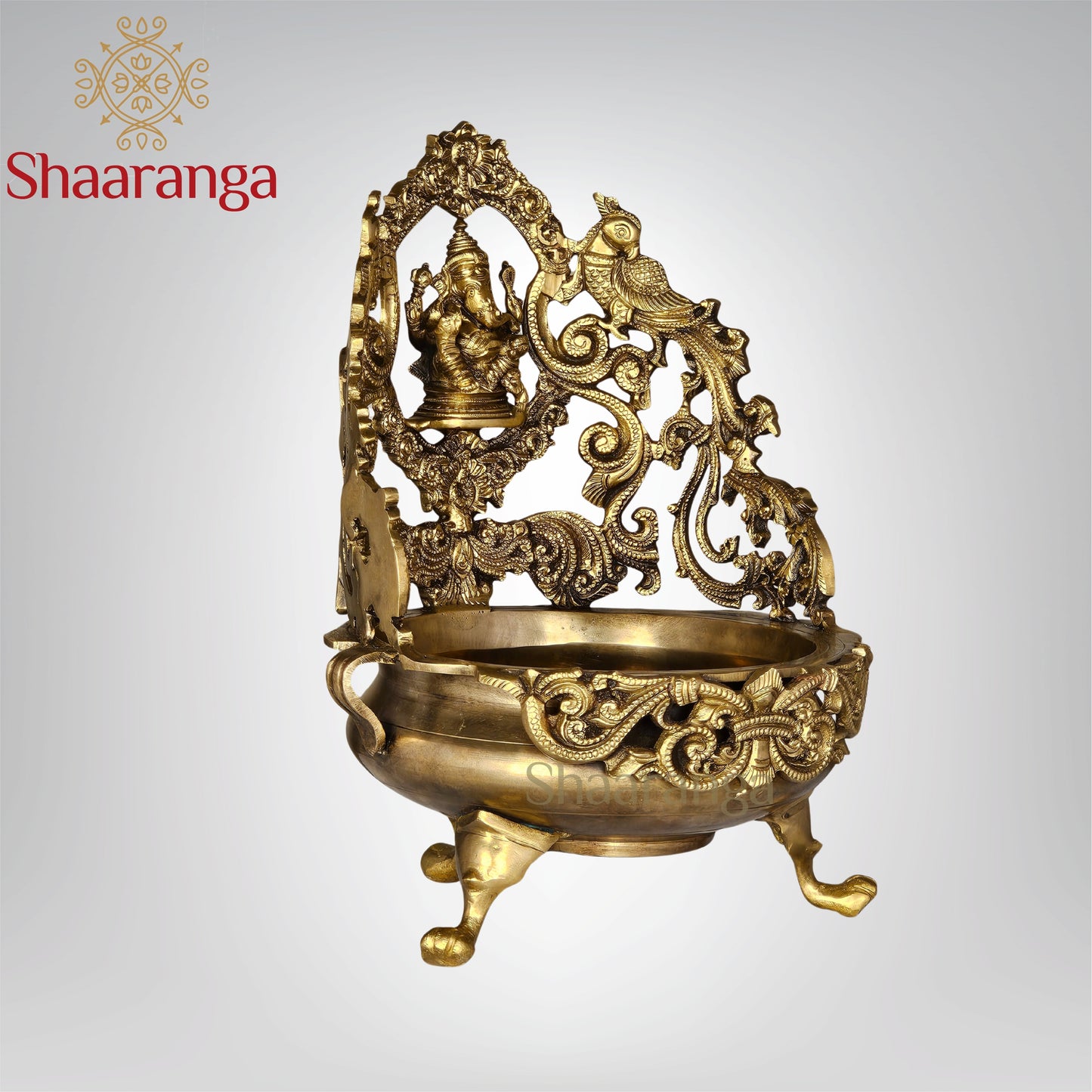 13 Inches Bronze Ganesh Urli with Intricate Peacock Design