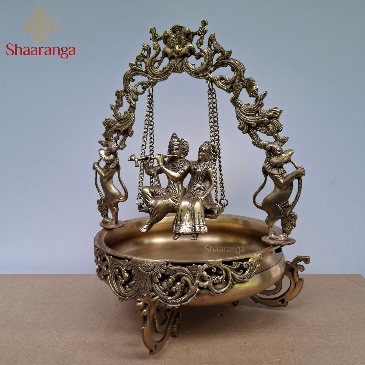 20 Inches Brass Radha Krishna Swing Urli with Ornate Yaali Arch