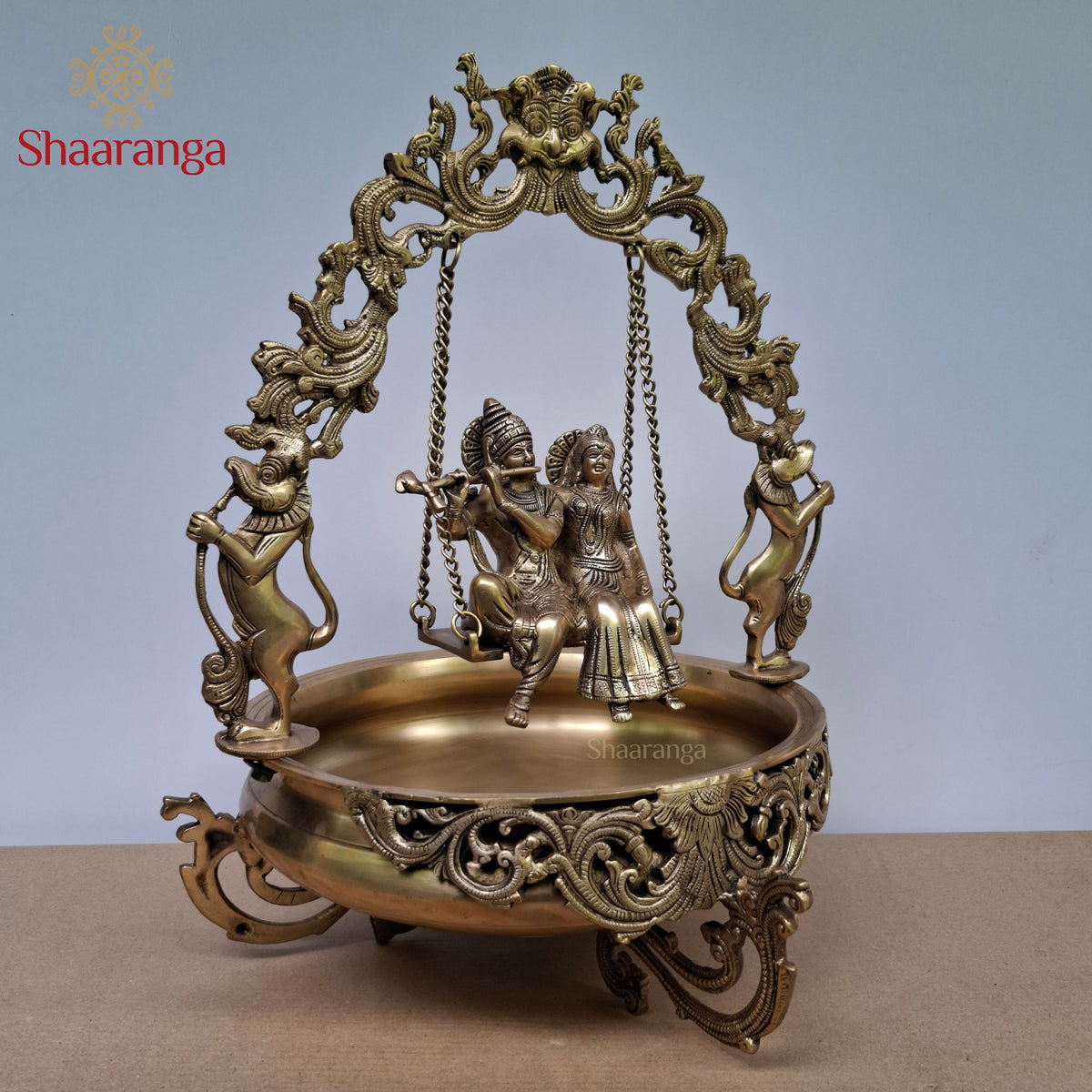 20 Inches Brass Radha Krishna Swing Urli with Ornate Yaali Arch