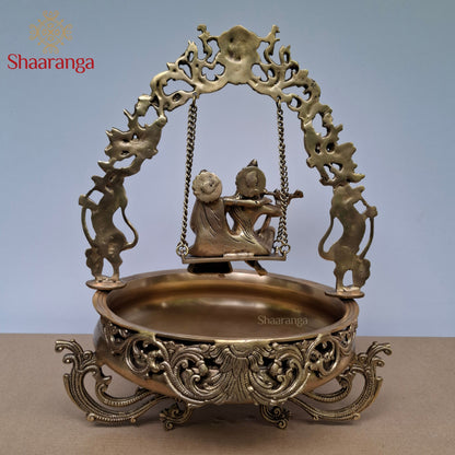 20 Inches Brass Radha Krishna Swing Urli with Ornate Yaali Arch