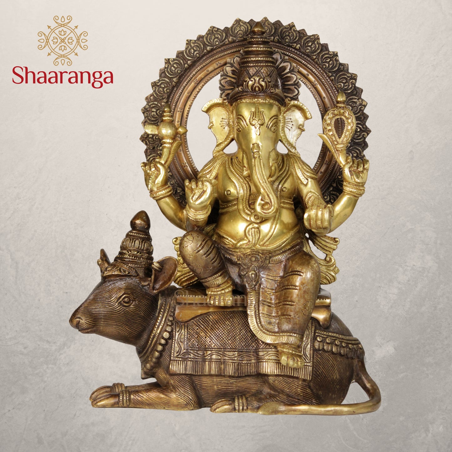 12 Inches Brass Ganesha idol Sitting on Rat in Two Tone finish.