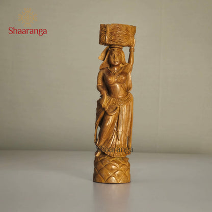 8-inch finely carved sandalwood figurine of a village lady carrying harvest