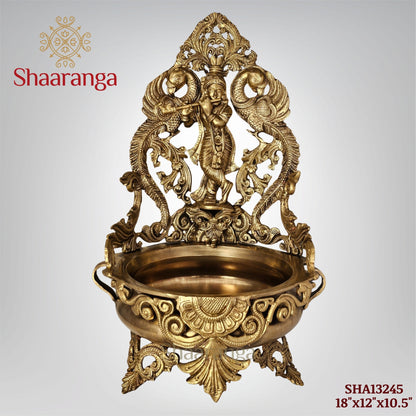 18 Inches Bronze Krishna Urli with intricate Peacock design