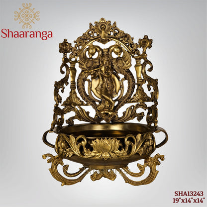 19 Inches Bronze Krishna Urli with intricate peacock and lotus design